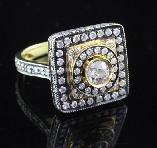 An 18ct gold and diamond set tablet ring, size P.